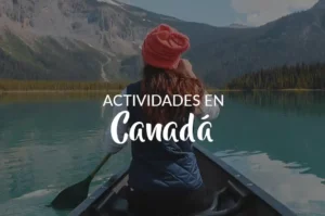 Mujer remando en lago cristalino frente a majestuosas montañas canadienses. Texto sobre imagen: Actividades en Canada